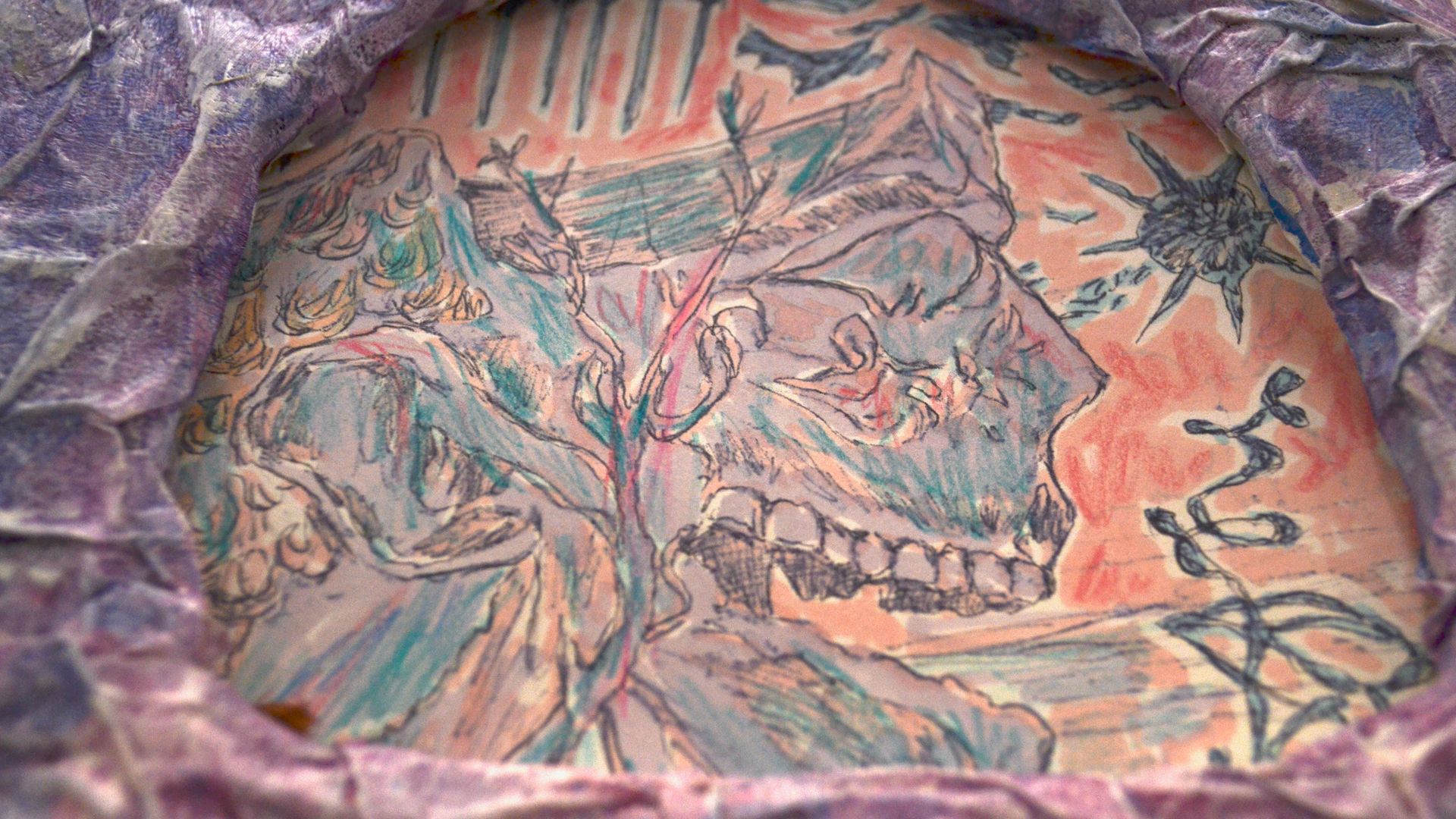 Painting of a skull in side profile surrounded by weapons including swords and a flail. Framed in an arch shape by crinkled purple papier mache.