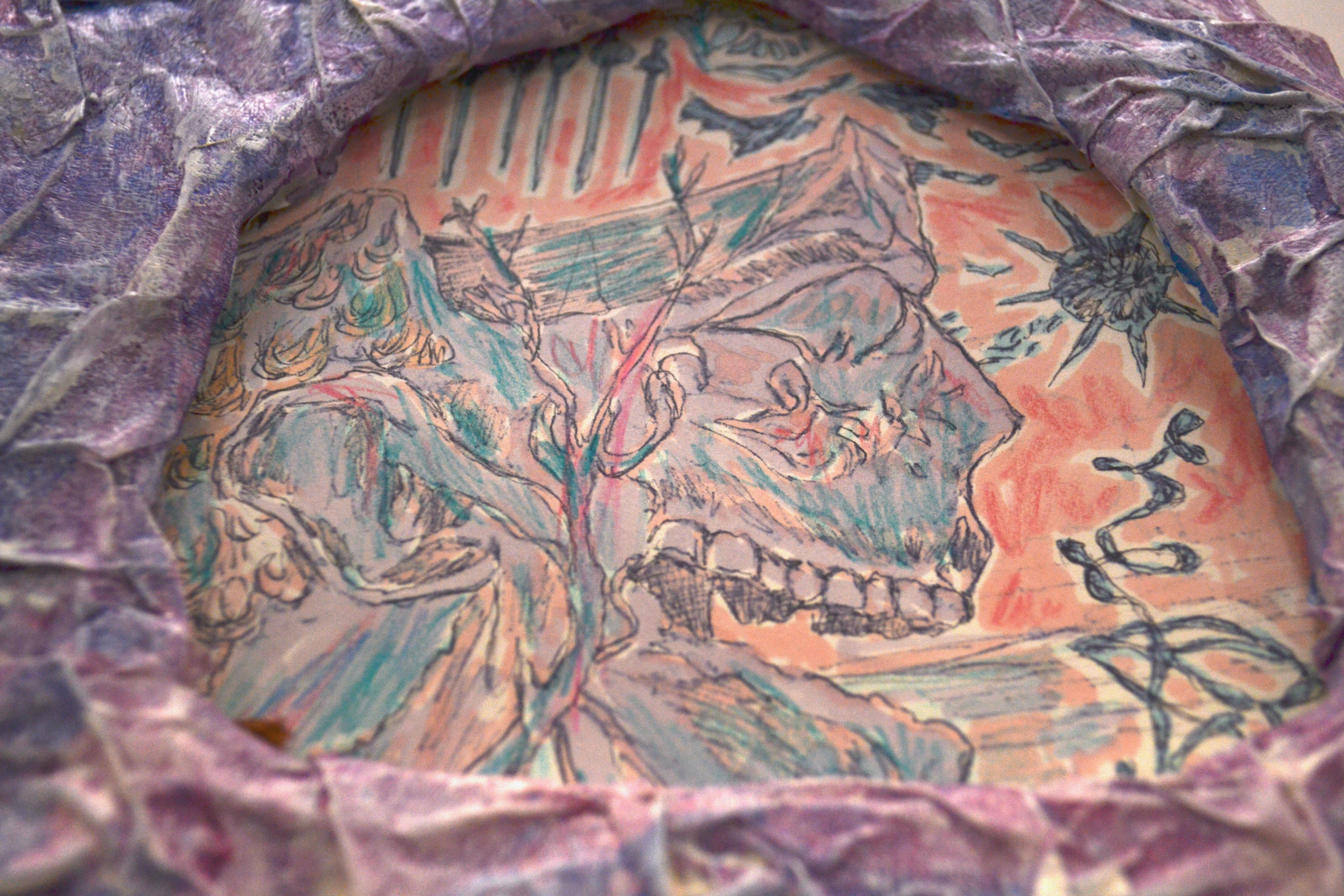 Painting of a skull in side profile surrounded by weapons including swords and a flail. Framed in an arch shape by crinkled purple papier mache.