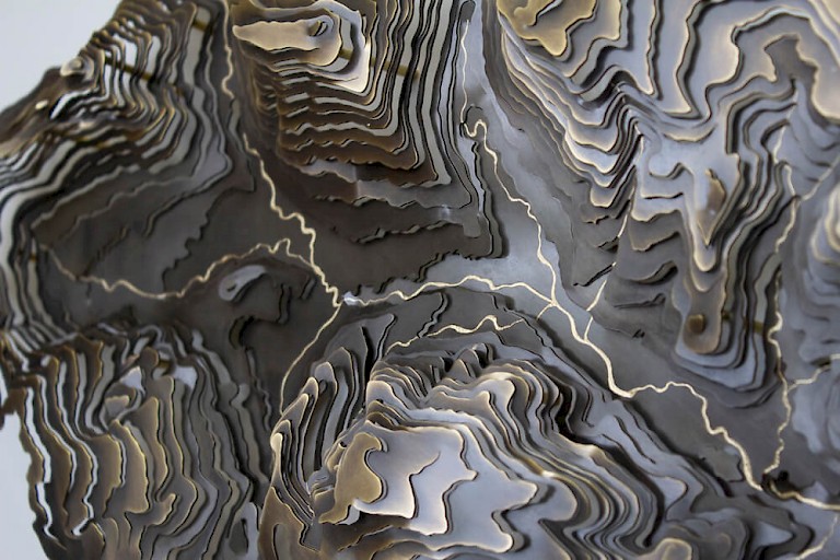Metal wall art by Contour Map Collection, 3D model of a landscape showing contours cut from sheets of brass and stacked.