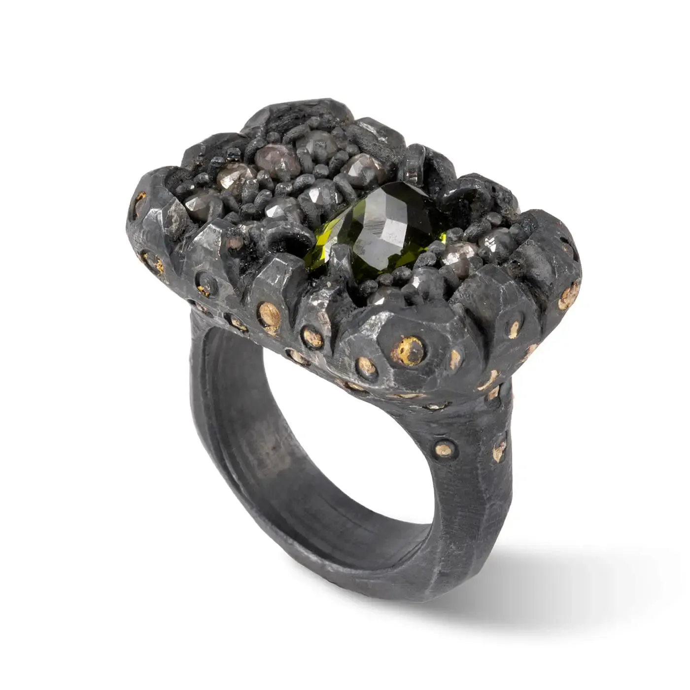 Ring by Jennie Gill, made from dark Whitby jet, with an organic rocky form and containing various gemstones.