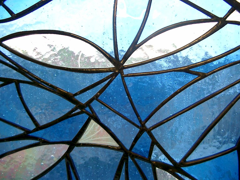 Section of a blue stained glass window by Katherine S Boyd.